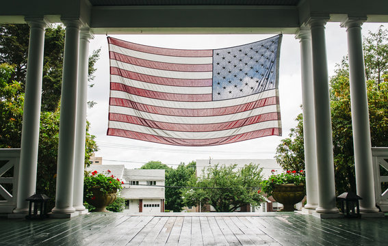 American flag hanging in the entrance of house