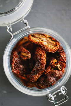 Sun dried tomatoes Closeup of an open jar of sundried tomatoes