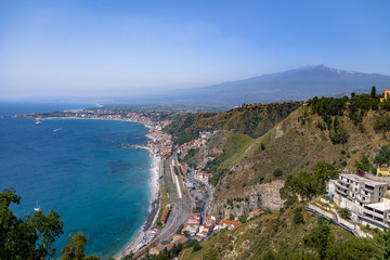 Fototapeta na wymiar Aerial view of Taormina city, mediterranean sea and Mount Etna Volcano - Taormina, Sicily, Italy