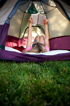 Camping Girl Reads Book Inside Tent
