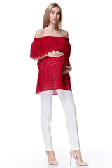 Beautiful elegant pregnant woman blond hair wear style fashion trousers red blouse for mother hold in hand tummy wait for baby child new born pretty clothes pregnancy white background casual heath.