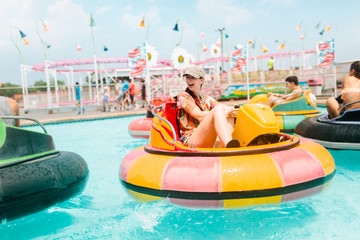 young woman enjoys a playful afternoon at water park 