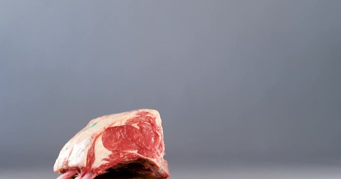 Raw beef ribs and cleaver