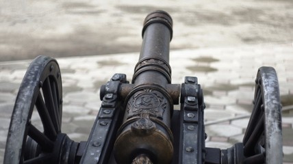 A copy of an old cannon with cores in the style of the times of colonization of the New World and the era of pirates, standing in the resort tourist zone of Nalchik.