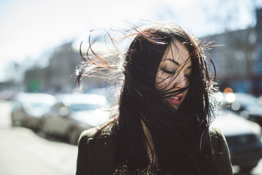 Punchy Portrait Of A Cool Young Woman Girl In The Wind