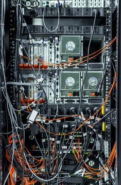 Complex array of wires at back of server cabinet
