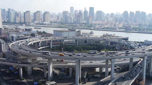 Aerial freeway busy city rush hour heavy traffic jam highway Shanghai china,nanpu overpass interchange.
