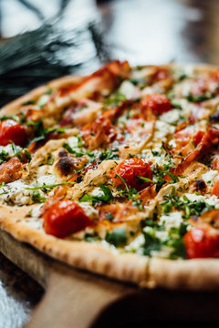 Close-up of pizza with cherry tomato and bacon