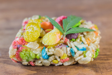 THC Treat with trimmed marijuana leaf for decoration