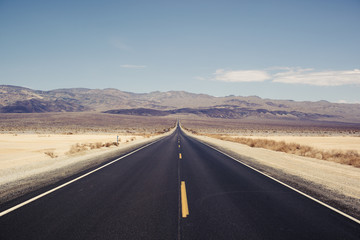 View of empty road against mountain range