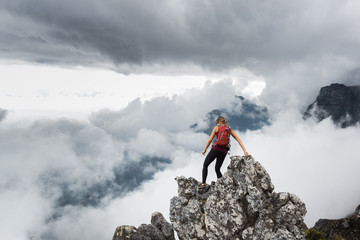 Fit active woman hiking in the mountains