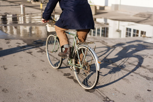 Man riding a bicycle on a shining day