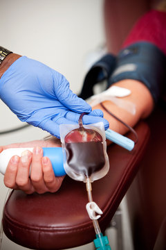 Blood Bank Woman In Chair Donating Blood
