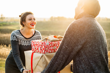 Girl receiving present from boyfriend