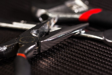 Closeup pliers on table background