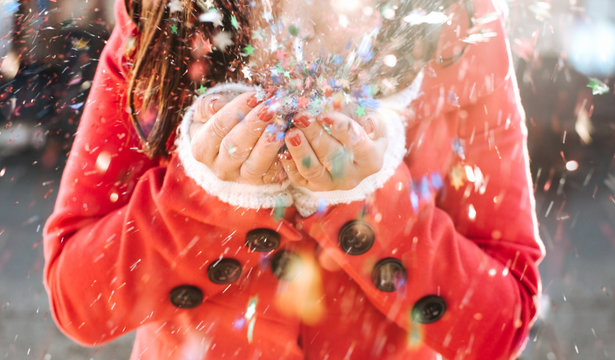 Woman Blowing Colourful Confetti