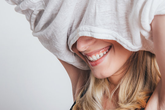 Woman taking shirt off