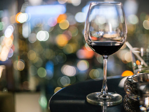 Party time- glass of red wine on table