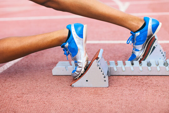 African american female feet on a starting block position