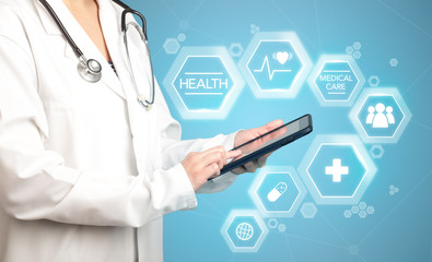 Female doctor with tablet