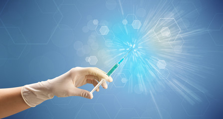 Female doctor holding syringe