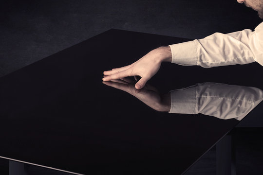 Close up of a hand touching smart table with copy space
