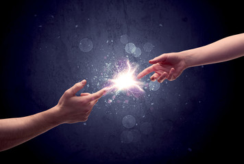 Hands reaching to light a spark