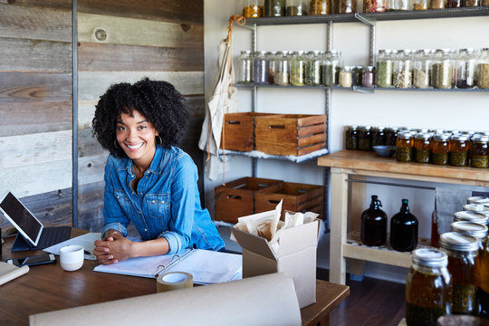 Millennial African American Woman businesswoman in her skincare studio