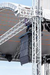 concert lighting and sound equipment on outdoor stage