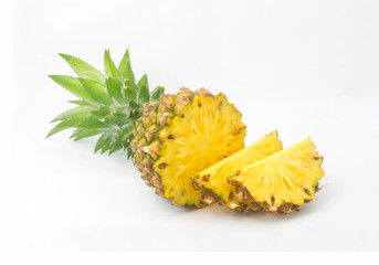Ripe pineapple with lush green leaves
