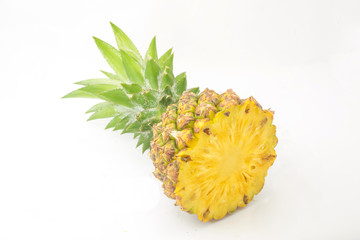 Ripe pineapple with lush green leaves