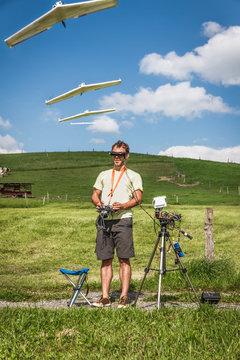 young man flying model airplane
