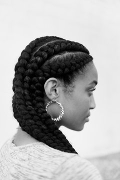 A young african american woman with braided hair