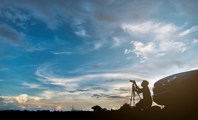 Photographer silhouette, beautiful sky background