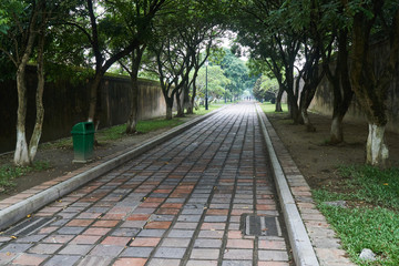 Empty footpath on a foggy day in the imperial city in Hue, Vietnam.