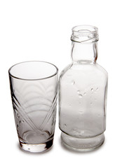 Vodka in a glass and decanter on a white background