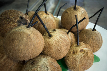 coconut with straw on the market