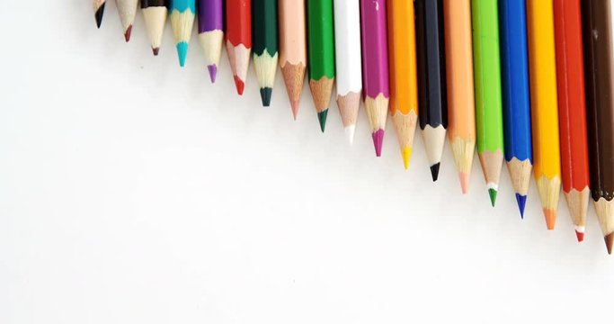 Colored pencils arranged in a row