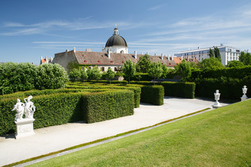 green labyrinth in the garden of the Belvedere lower palace and a view of the dome of the church. Vienna - obrazy, fototapety, plakaty