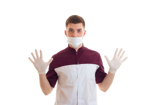 Cheerful Young Doctor In Rubber Gloves And Mask
