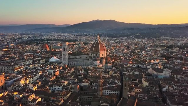 florence cathedral brunelleschi's dome aerial view at sunrise flying sideways