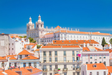     Aerial scenic view of central Lisbon Portugal with red tile roofs and monastery Igreja Sao Vicente de Fora 