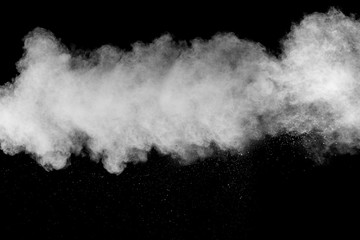 Freeze motion explosion of white dust on  black background.