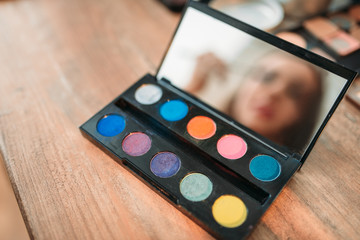 Collection of cosmetology tools on wooden table