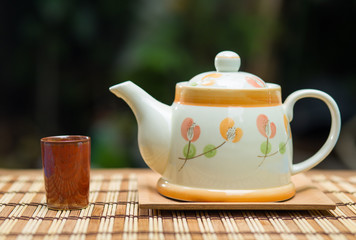 Teapot and hot tea on wooden table , Tea breaking time.