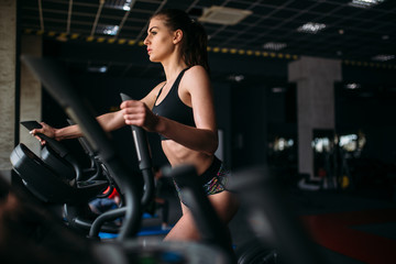 Fototapeta na wymiar Female athlete exercise on treadmill in sport gym
