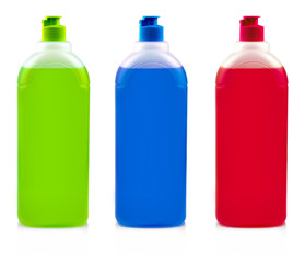 Tree colore bottles with dishwashing detergent on white