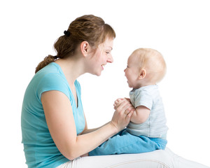 Portrait of mother and baby son laughing and playing