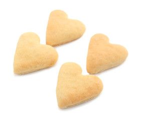 Heart shaped butter cookies on white background