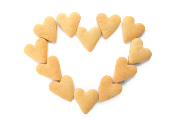 Heart shape made of butter cookies on white background